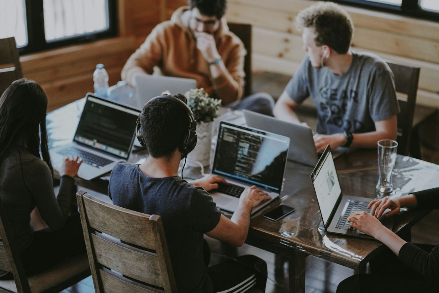 One team working together around a single table
